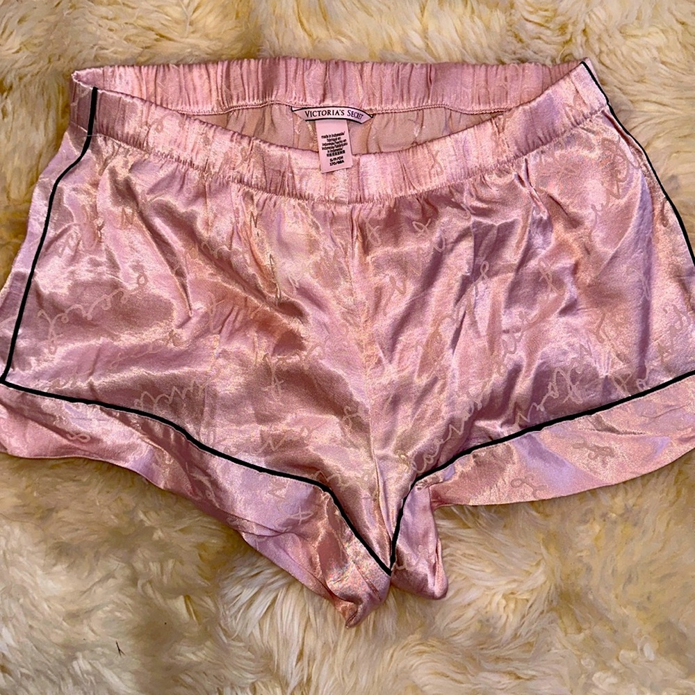 Victoria’s Secret pink satin pajama shorts with black ribs lining size small